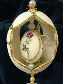Egg is another torus symbol, and a smaller egg inside it
                                      is a smaller torus, the core of that torus.